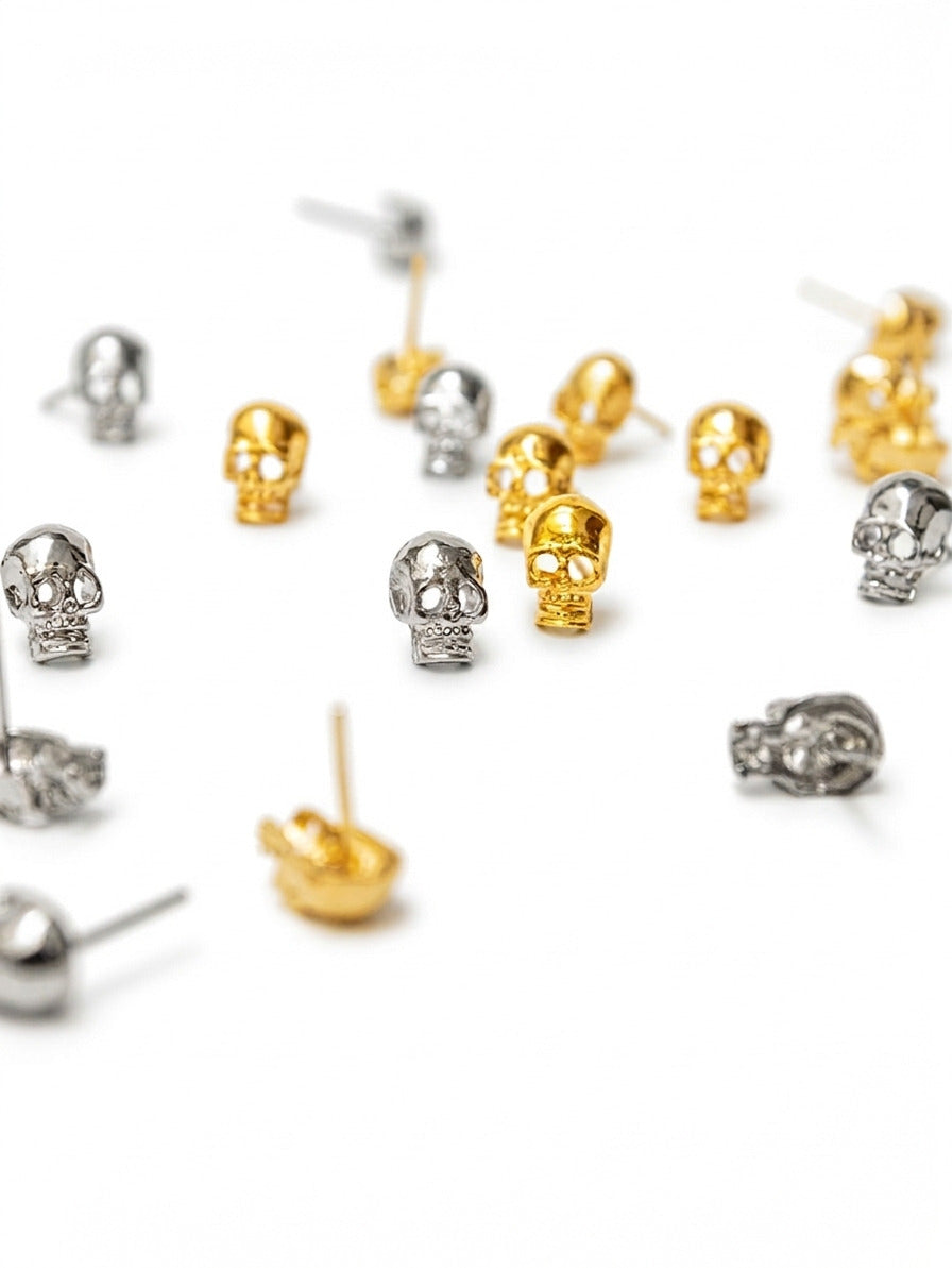 aretas y topos calavera dorado y plateado 